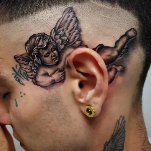 angel behind the ear tattoo