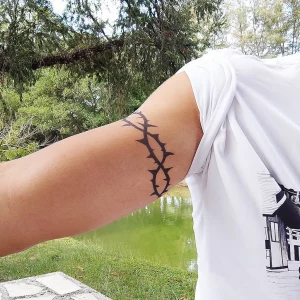 7 Bold Barbed Wire Wrapped Around Arm Tattoo
