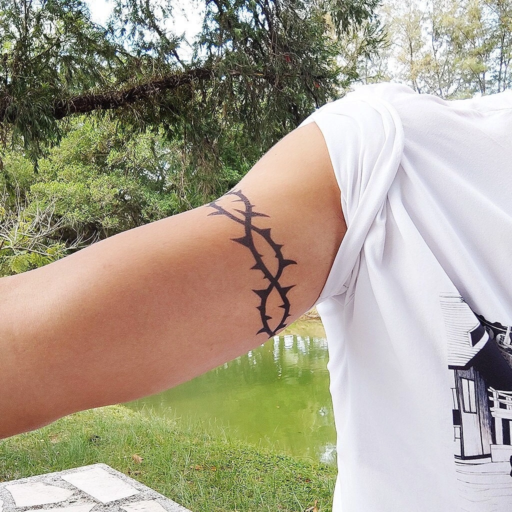 Barbed Wire Wrapped Around Arm Tattoo