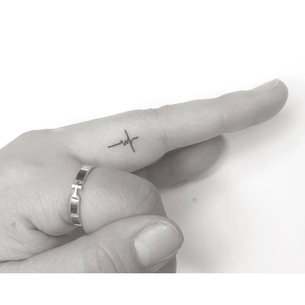 20 Elegant Cross Tattoo On Ring Finger Style Guide
