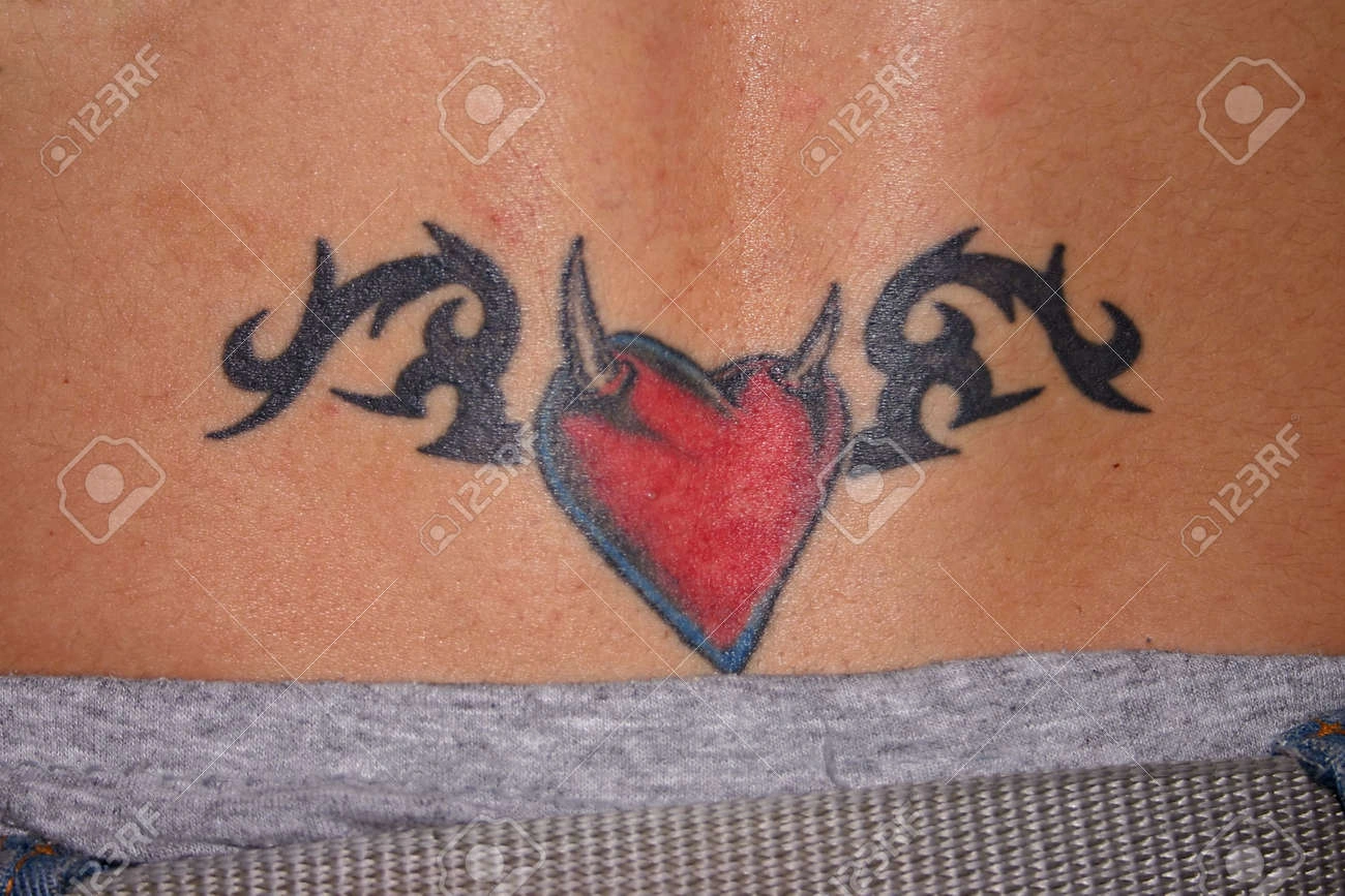9 Stunning Heart Tattoo On Lower Back Bold, Yet Unique