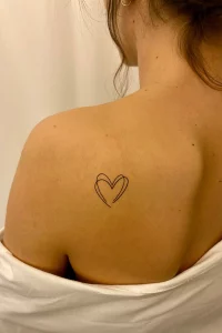 Elegant Heart Tattoo On Neck Back - A Quiet Expression