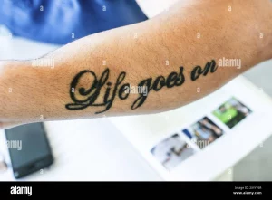 8 Life Goes On Tattoo On Hand: A Symbol Of Resilience