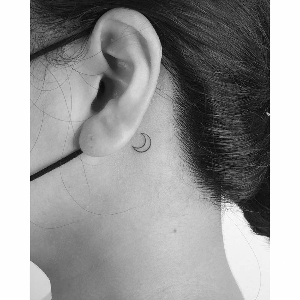 12 Elegant Moon Tattoos Behind The Ear: A Subtle Glow