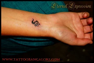 27 Radiant Calm: Positive Energy Female OM Tattoo Designs