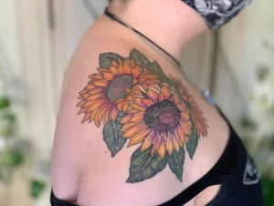 sunflower tattoo on the shoulder