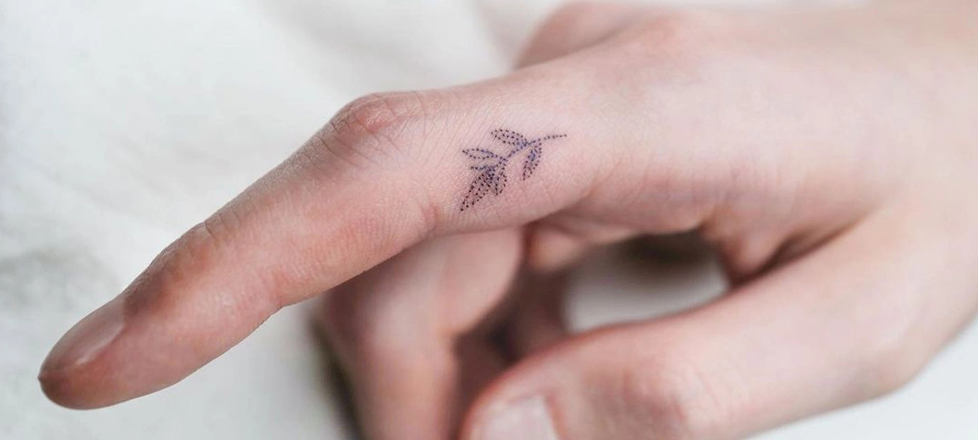 10 Tiny Tattoos Between Thumb & Pointer Finger: Hidden