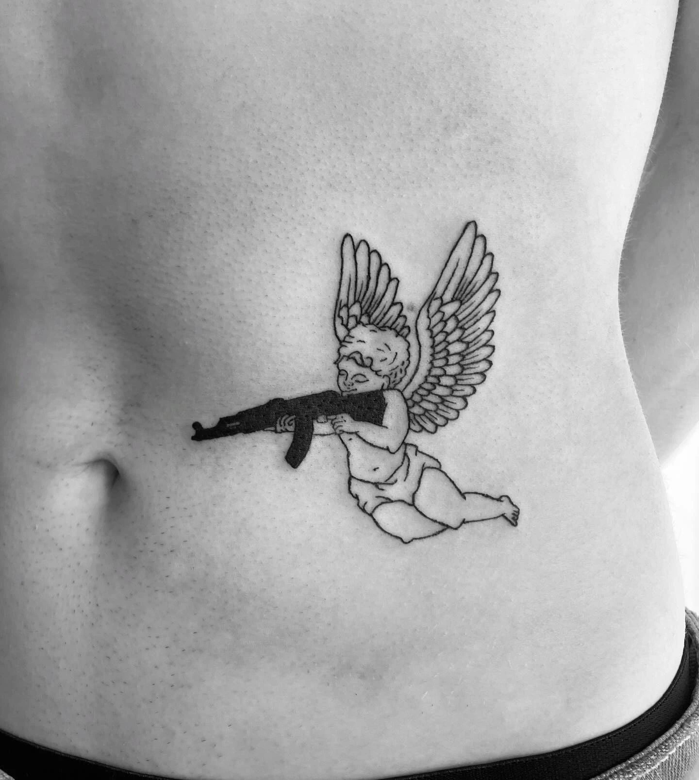 8 Bold Tattoos Of Guns On Stomach To Define You